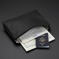 Fireproof and waterproof document bag open showing passport and documents inside
